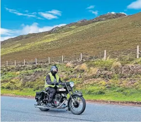  ?? ?? And here is John Loosemoore, suitably caffeinate­d, out on the run on his M100.