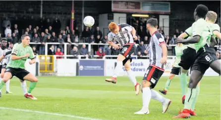  ?? PICTURES: Simon Howe ?? Tom Smith was unable to take two headed chances in the first half against Hemel Hempstead