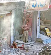  ?? (AFP) ?? A man inspects the site of a car bomb explosion in the northern Syrian Kurdish town of Tal Abyad on Saturday