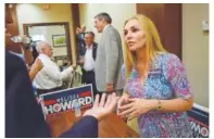  ?? Phil Diederich, Sarasota Herald-tribune ?? Melissa Howard meets with voters in Lakewood Ranch, Fla., in July. Howard falsely claimed she had a college degree, posted a purported copy of her diploma online then dropped out of her race for a statehouse seat.