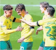  ??  ?? Kieran Dowell (Norwich City) celebrates his goal with team-mates