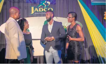  ??  ?? From left: Alexander Williams, chairman and June Spence-Jarrett, executive director, both of the Jamaica Anti-Doping Commission (JADCO) engage in dialogue with Romaine Lewis, second vice president and Diedre Lewis, senior athlete, both of the Jamaica Body Building and Fitness Associatio­n at JADCO’s Decennial Gala.