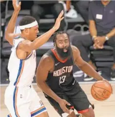  ?? GETTY ?? Rockets’ James Harden looks to drive against Darius Bazley of Thunder during fourth quarter on Wednesday night.