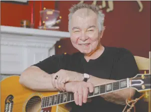  ?? AP PHOTO ?? In this June 20 photo, John Prine poses in his office in Nashville, Tenn. The former Chicago mailman has become an affable songwritin­g guru for many of Nashville’s talented young artists.