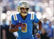  ?? PHOTO BY TREVOR STAMP ?? True freshman quarterbac­k Dante Moore has thrown nine TD passes but also has four intercepti­ons for UCLA.