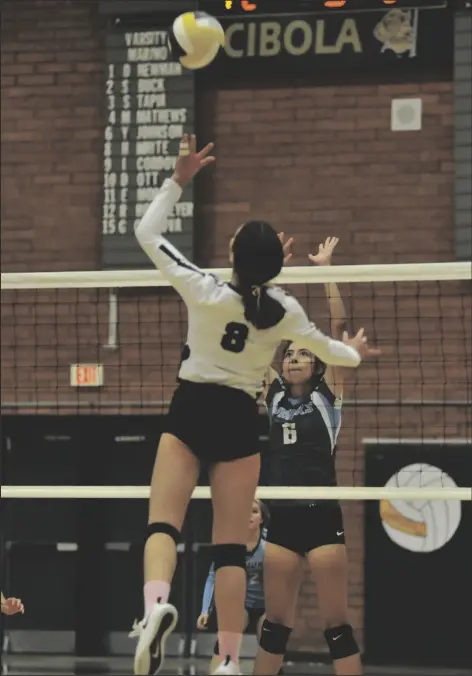  ?? CIBOLA SENIOR HEIDI WHITE PHOTO BY JACKSON RAMER/ YUMA SUN ?? Buy this photo at YumaSun.com spikes a ball past a Gila Ridge defender during Thursday’s game at Cibola High School.