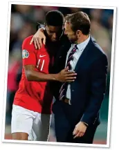  ??  ?? BOND: Rashford, who had been the victim of racial abuse, with Southgate