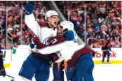  ?? JASON FRANSON/ASSOCIATED PRESS ?? Colorado left wing J.T. Compher (37) celebrates his goal against Edmonton with Bowen Byram (4) during the third period Saturday ngiht’s game.