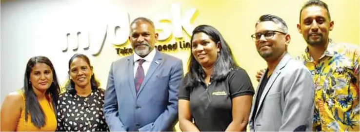  ?? ?? Minister for Commerce, Trade, Tourism and Transport, Faiyaz Koya (third from left) with founder of MyDesk, Dipti Sharma (fourth from left) during the official launch of MyDesk, in Nadi on December 17, 2021.