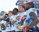  ?? GEORGE WALKER IV/TENNESSEAN.COM ?? Titans players line up for the National Anthem before the game at Nissan Stadium on Sept. 30, 2018.