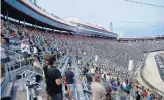  ?? PATRICK SMITH/GETTY IMAGES ?? Fans stand during pre-race ceremonies prior to the NASCAR Cup Series All-Star race in Bristol, Tennessee.