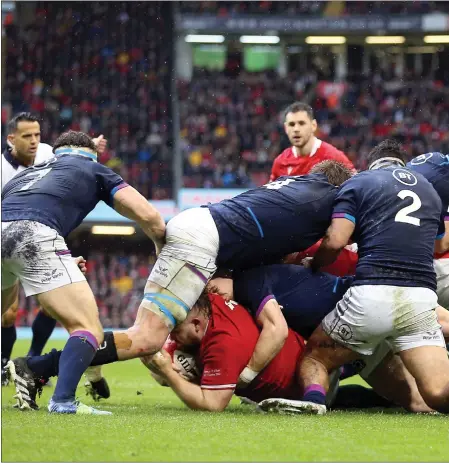  ?? ?? Tomas Francis, left, touches down for Wales’ try at the Principali­ty Stadium