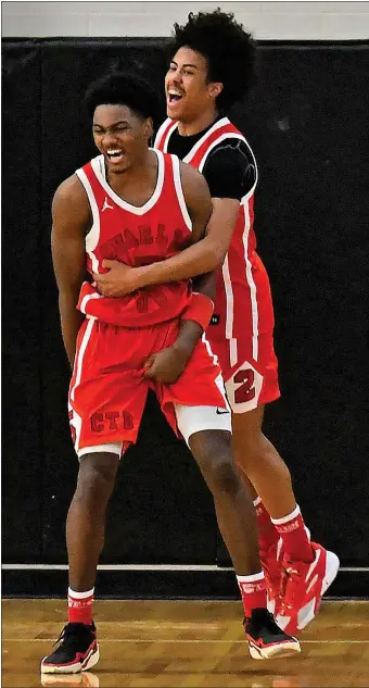  ?? CHRIS CHRISTO — BOSTON HERALD ?? Woburn, MA - February 18, 2024: Charlestow­n’s Damante Vanheyning­en celebrates his last second game winning basket with team mate Jordany Mack in their game against Needham.