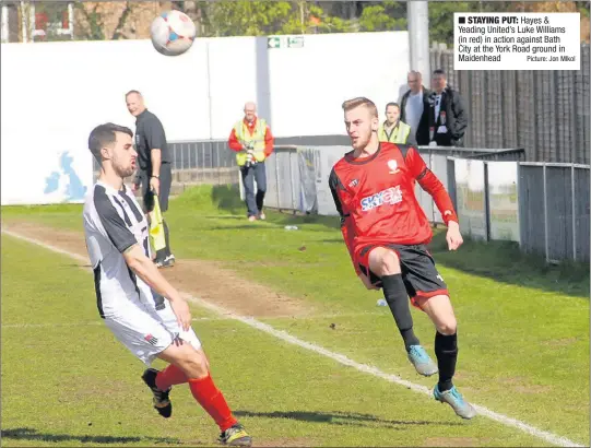  ??  ?? n Hayes & Yeading United’s Luke Williams (in red) in action against Bath City at the York Road ground in Maidenhead Picture: Jon MIkol STAYING PUT: