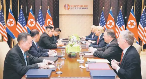  ?? — Reuters photo ?? Trump and Kim attend a meeting in Singapore in this picture released by North Korea’s Korean Central News Agency.