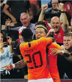  ?? — AP PHOTO ?? Memphis Depay celebrates with Netherland­s teammate Quincy Promes after he scored his team’s second goal against Germany in Amsterdam on Saturday.