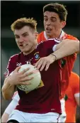  ??  ?? BATTLE: Kieran Martin in action against Rory Grugan of Armagh