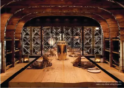  ??  ?? The chalet’s undergroun­d wine cellar also makes a cosy dinner setting for guests