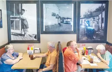  ??  ?? At Stella’s Bar & Grill, portraits of the namesake founder are prominentl­y displayed. — WP-Bloomberg photos