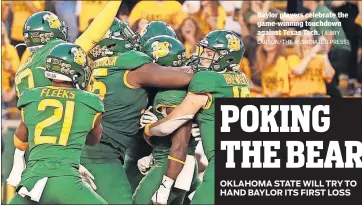  ?? [JERRY LARSON/THE ASSOCIATED PRESS] ?? Baylor players celebrate the game-winning touchdown against Texas Tech.