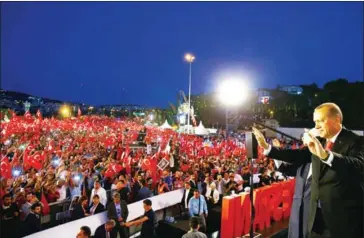  ?? AFP PHOTO/TURKISH PRESIDENTI­AL PRESS SERVICE ?? This handout photograph released on Saturday by the Turkish Presidenti­al Press Service shows Turkey’s President Recep Tayyip Erdogan (right) as he waves after arriving at a ceremony at Bosphorus Bridge in Istanbul.