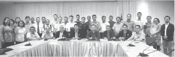  ??  ?? Belayong (seated fourth left) is seen with organising committee members after the meeting.