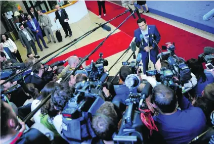  ?? Laurent Dubrule / EPA ?? Greece prime minister Alexis Tsipras addresses the media after the eurozone leaders’ summit on the Greek crisis in Brussels yesterday. A new bailout programme was agreed upon, but Mr Tsipras faces opposition at home, even within his own party.