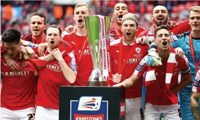  ?? BPI ?? Pride of Yorkshire: Barnsley celebrate winning the Johnstone’s Paint Trophy yesterday