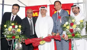  ?? — Photo by Juidin Bernarrd ?? Mohammad Zohaib Khan; Rehman Chaudhry; Adeel bin Turkeya, chairman, Dubai Auto Zone (DAZ); Takaaki Tsubouchi from Mikawa Daihatsu; and Ahmed Abdul Raheem, senior manager at DAZ, inaugurati­ng Dubai Auto Auction on Monday.