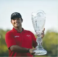  ?? (Reuters) ?? PATRICK REED holds up the Barclays trophy on the 18th green, during the final round of The Barclays golf tournament at Bethpage State Park in Long Island, New York, on Sunday.