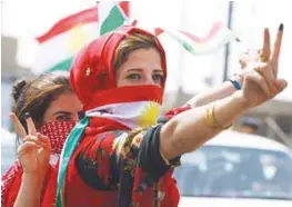  ?? AFPPIX ?? Iraqi Kurdish women celebrate in Kirkuk, northern Iraq, on Monday after voting “Yes” to independen­ce in a referendum.