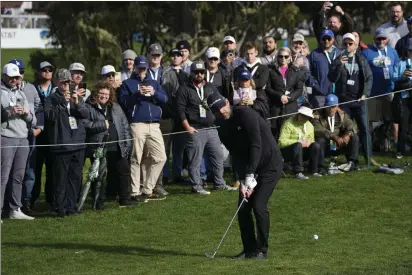  ?? PHOTOS BY GODOFREDO A. VÁSQUEZ — THE ASSOCIATED PRESS ?? Aaron Rodgers follows his shot onto the 16th green of the Pebble Beach Golf Links during the third round of the AT&T Pebble Beach ProAm golf tournament in Pebble Beach on Sunday.