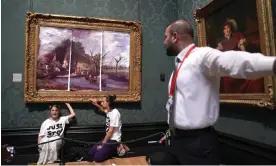  ?? Gallery, London. Photograph: Kirsty O’Connor/PA ?? Just Stop Oil protesters glue their hands to the frame of John Constable's The Hay Wain at the National