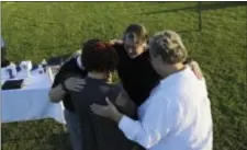  ?? STEPHEN B. THORNTON — THE ARKANSAS DEMOCRAT-GAZETTE VIA AP ?? Gina Grimm, daughter of inmate Jack Jones, bottom left, prays with members of the Episcopal Church outside the Varner Unit on Monday near Varner, Ark. Jack Jones and Marcel Williams received lethal injections on the same gurney Monday night, just about...