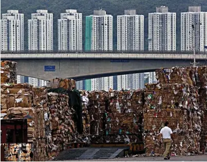  ??  ?? Waste of space: Hong Kong’s paper mountains grow in Chinese ‘foreign garbage’ crackdown