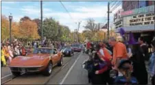  ?? KATHLEEN CAREY – DIGITAL FIRST MEDIA ?? A line of cars drives past the Media Theatre as the end of the Halloween parade approaches.