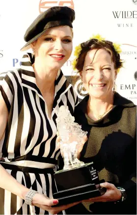  ?? Picture: JC PHOTOGRAPH­ICS ?? RACING ROYALTY. Jessica Slack (right) accepts the trophy from HSH Princess Charlene of Monaco after Nother Russia won the Grade 1 Empress Club Stakes over 1600m at Turffontei­n on Saturday. (See Back Page).