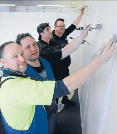  ?? Photo: RHIANNON McCONNELL ?? New look: Wall covering team Warren Findlay, Callan Skipper, Mark Piper and Brenden White.