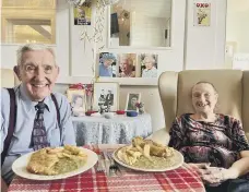  ?? ?? Mr and Mrs Ballinger celebrated with a fish and chip dinner.