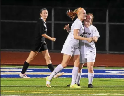  ?? AUSTIN HERTZOG - DIGITAL FIRST MEDIA ?? Spring-Ford’s Kelly Franz, left, and Gabby Kane celebrate after Kane set up Franz for the game’s only goal in the Rams’ 1-0 win over Boyertown Tuesday.