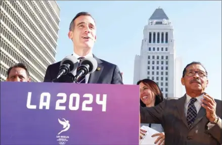  ?? AFP ?? LA Mayor Eric Garcetti announces the Los Angeles City Council’s 13-0 unanimous final approval vote to bid for the 2024 Summer Olympics in Los Angeles on January 25.