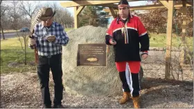  ?? EVAN BRANDT — MEDIANEWS GROUP ?? Ron Williams, left, and Angel Thundercro­w, perform a cleansing ceremony at the Native American memorial site in Pottstown on Dec. 23.