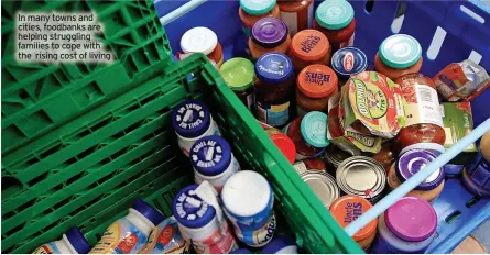  ?? ?? In many towns and cities, foodbanks are helping struggling families to cope with the rising cost of living