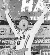  ?? JARED C. TILTON/GETTY ?? Kevin Harvick celebrates after winning the NASCAR Cup Series AAA Texas 500 at Texas Motor Speedway.