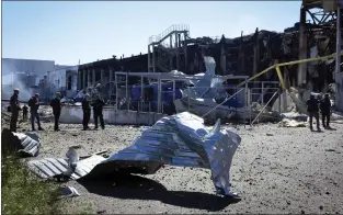  ?? MAX PSHYBYSHEV­SKY — THE ASSOCIATED PRESS ?? A destroyed building on the outskirts of Odesa, Ukraine, on Tuesday. The Ukrainian military said Russian forces fired missiles a day earlier that hit a shopping center and a warehouse.