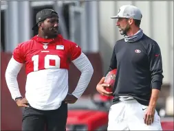  ?? RANDY VAZQUEZ/ BAY AREA NEWS GROUP ?? The 49ers' Deebo Samuel, left, speaks with head coach Kyle Shanahan during practice at Levi's Stadium in Santa Clara on Aug. 26, 2020.