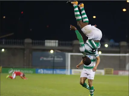  ??  ?? Shamrock Rovers’ Dan Carr celebrates his goal, while Sligo Rovers’ Rhys McCabe stays down after an alleged elbow. Pics: George Kelly.