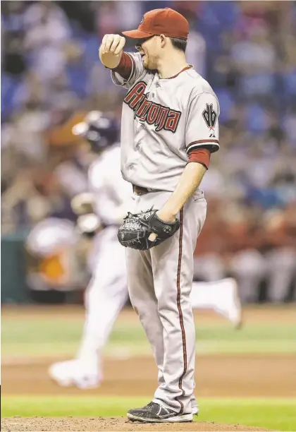  ?? CHRIS O’MEARA/AP ?? RAYS 5, D-BACKS 2: Diamondbac­ks right-hander Ian Kennedy tries to regroup as the Tampa Bay Rays' Yunel Escobar rounds the bases after hitting a fourth-inning homer Tuesday in St. Petersburg, Fla.