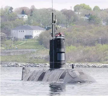  ?? ANDREW VAUGHAN/THE CANADIAN PRESS ?? HMCS Windsor, one of Canada’s four Victoria-class submarines. Purchasing subs from the U.K. resulted in parts shortages that “crippled” the fleet, says Patrick Finn, assistant deputy minister of materiel at National Defence.