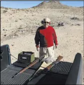  ??  ?? John Hoge was one of the few people on Tuesday who were following county and federal rules at the BLM-administer­ed shooting range in the southern valley.